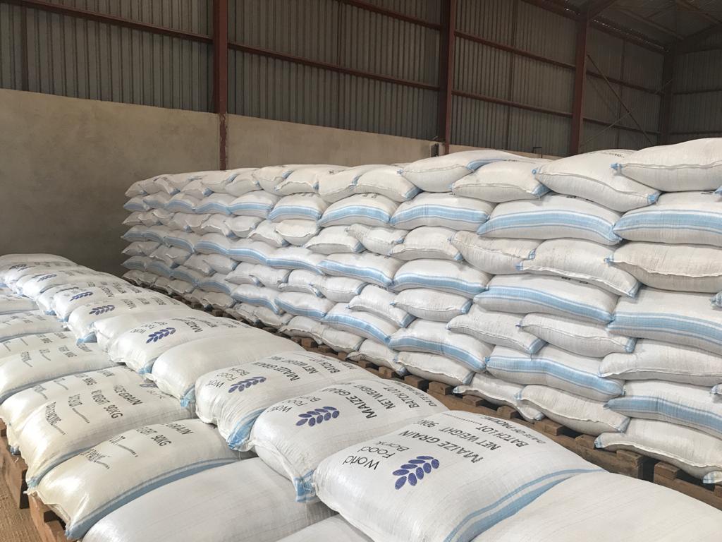 Aggregated maize in 90kg World Food Bank bags, stacked and ready for market.