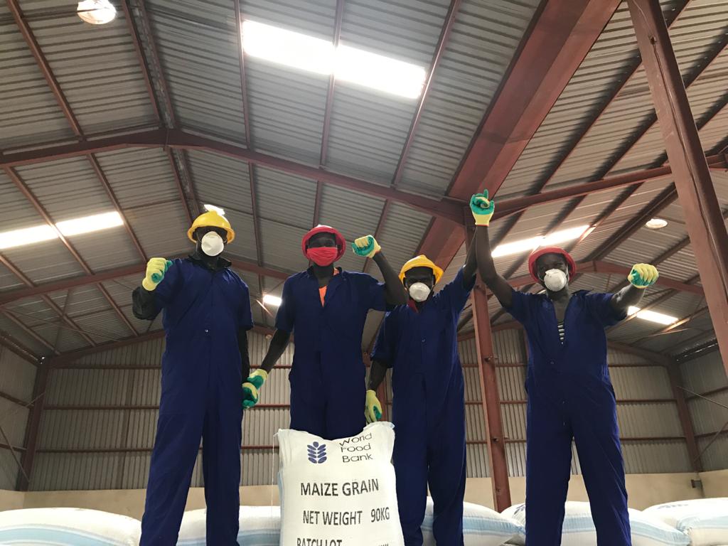 The warehouse team celebrates another successful maize intake.
